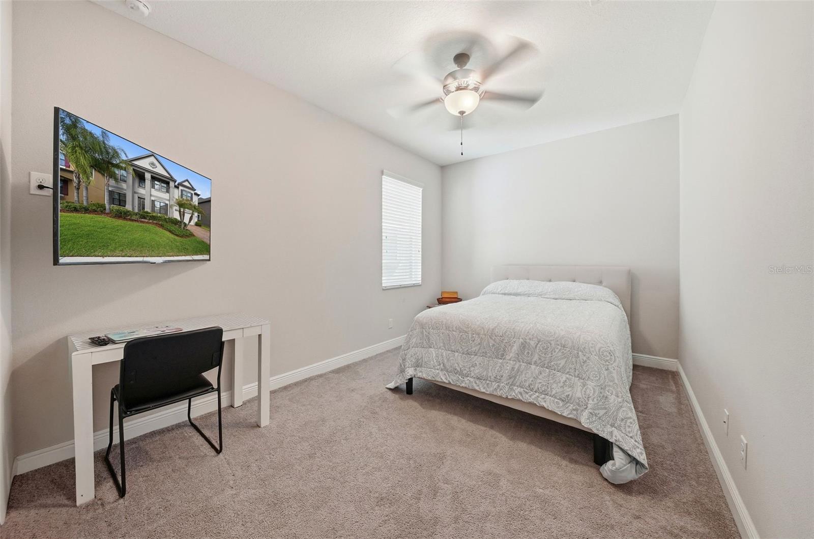 Tucked behind the ktichen area is a main-level bedroom 1 offers ultimate flexibility, perfect for a guest suite, private in-law (MIL) retreat, or a quiet home office. Conveniently located and thoughtfully designed, it provides comfort, privacy, and functionality all in one space.