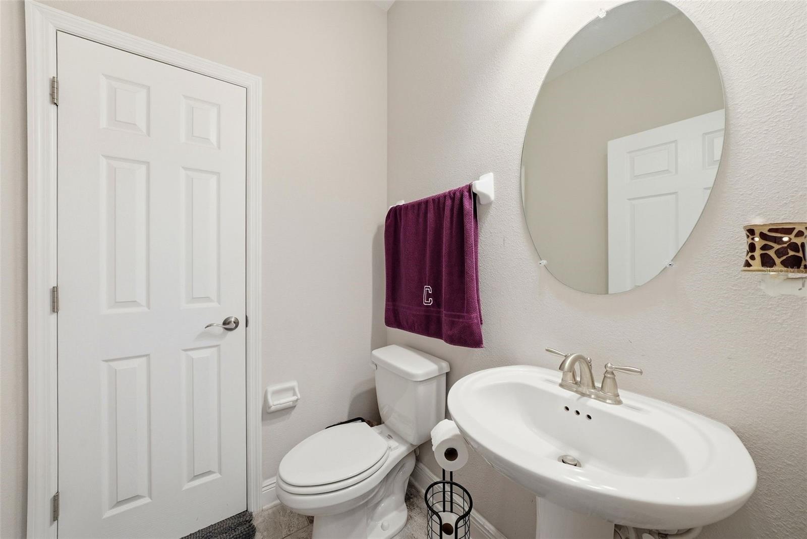 A conveniently located half bath on the main floor provides added functionality for guests and everyday living.