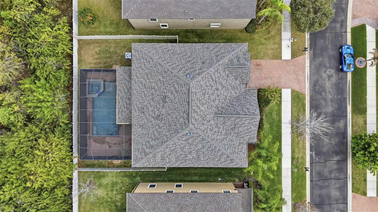 Enjoy your own private outdoor retreat featuring a screened-in lanai with elegant pavers, a heated pool and spa, and no rear neighbors—offering the perfect blend of comfort, privacy, and year-round relaxation.