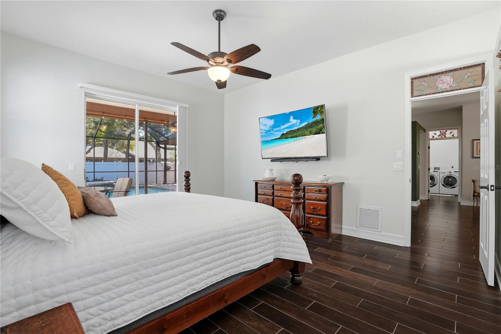 Master bedroom with view of the pool