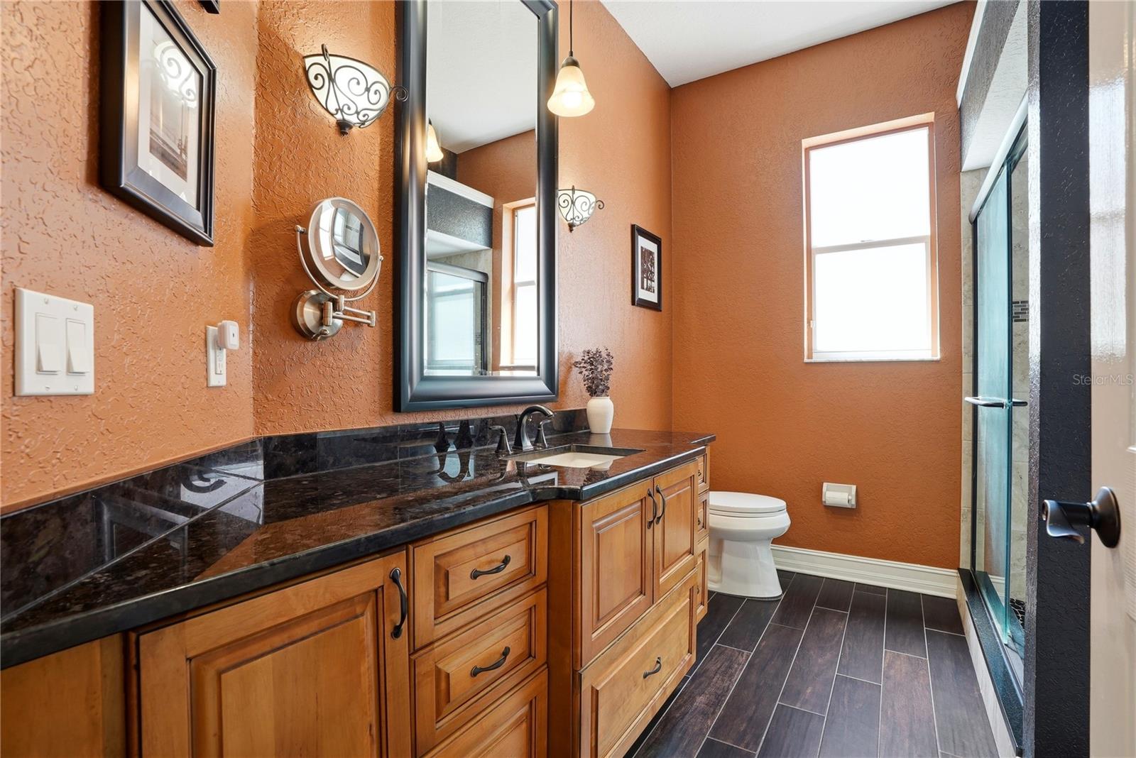 Hall bathroom connecting to bedroom 2 with another access to the hallway