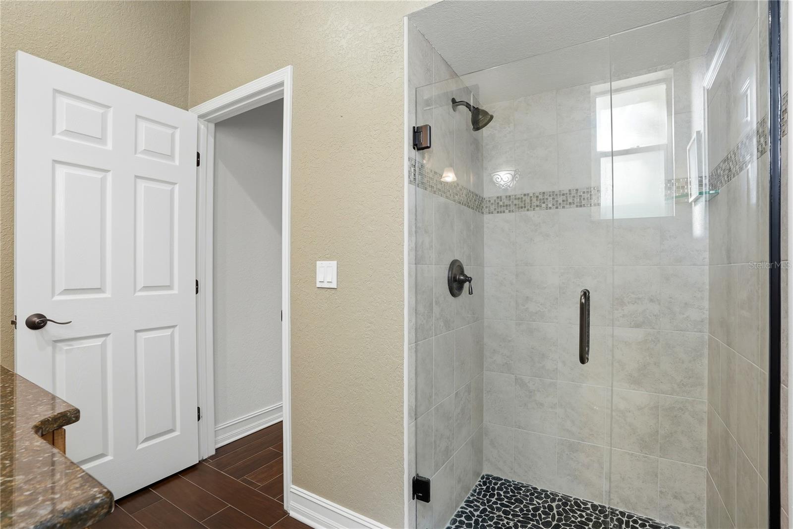 Bathroom 3 off of the 4th bedroom with access to the pool