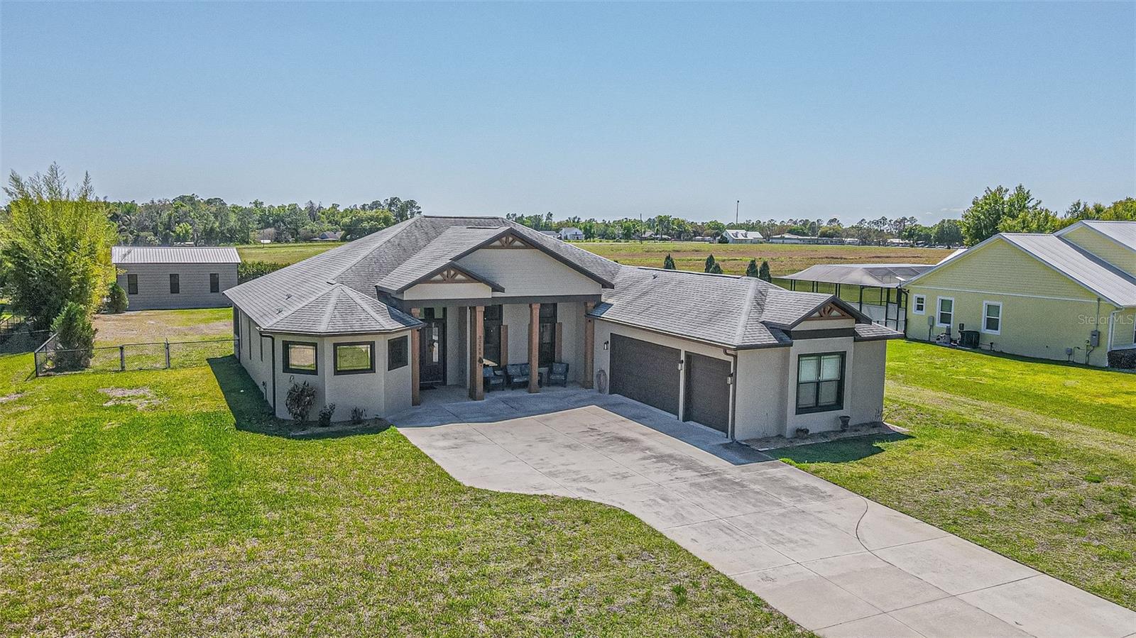 Custom home on 1 Acre Gated Kumquat Landings!
