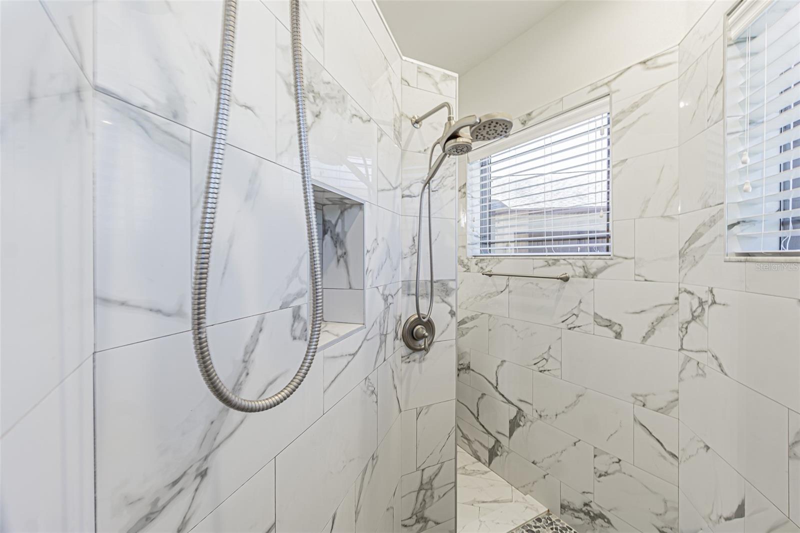 Stunning shower with seat and transom windows