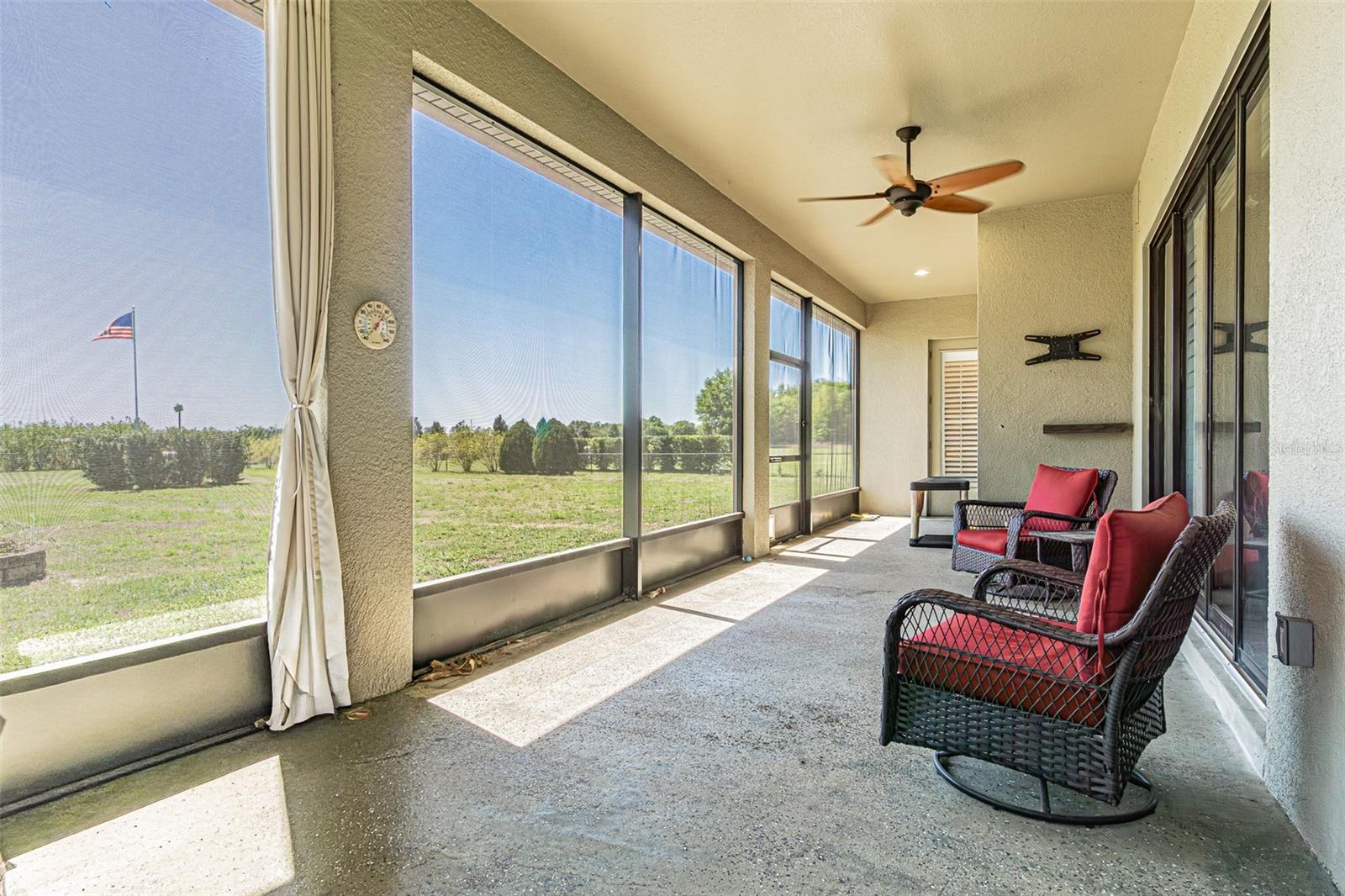 Screened Lanai on back overlooks fenced back yard.