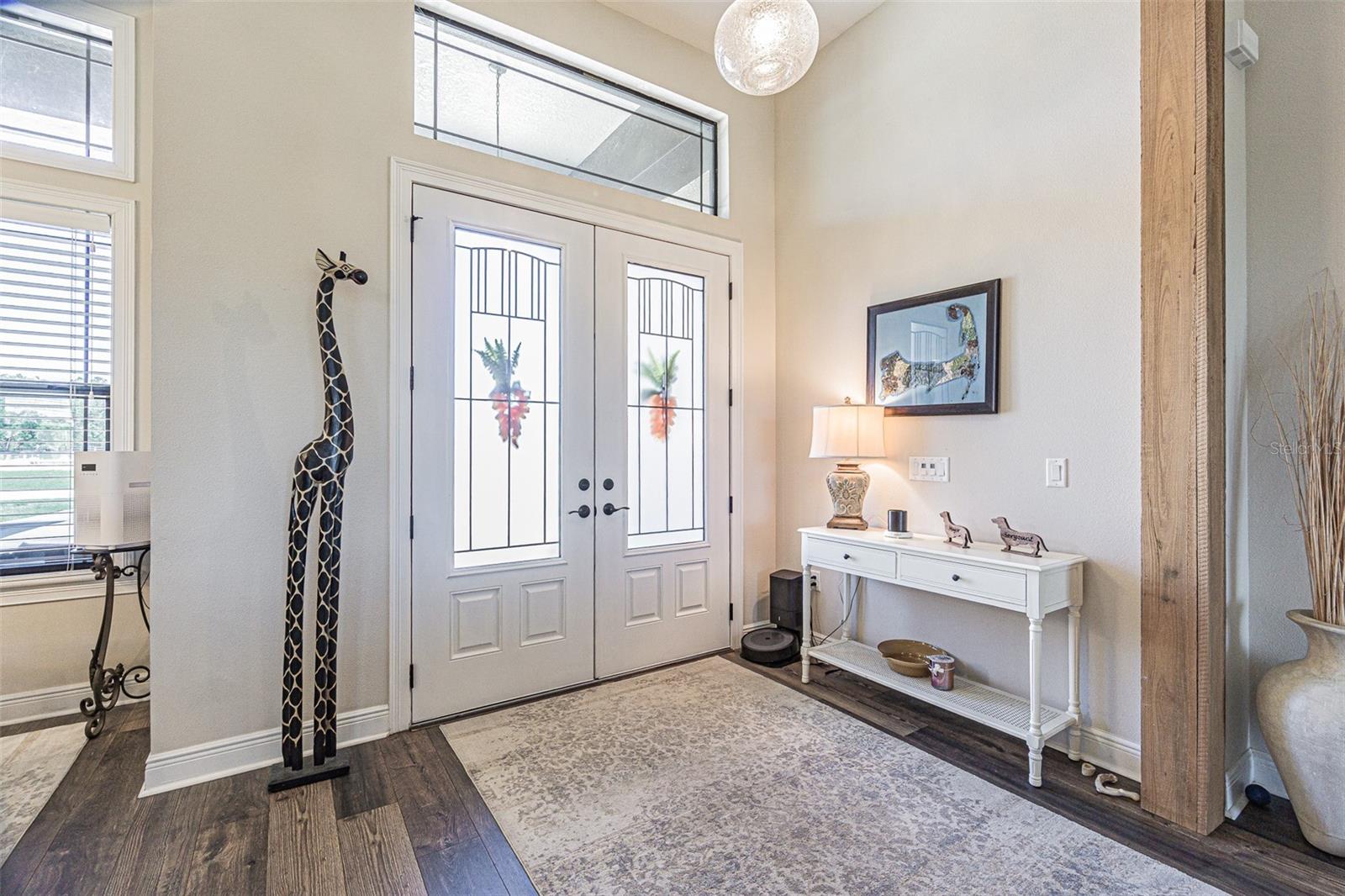 Foyer with double doors and transom windows for a light airy feel~!