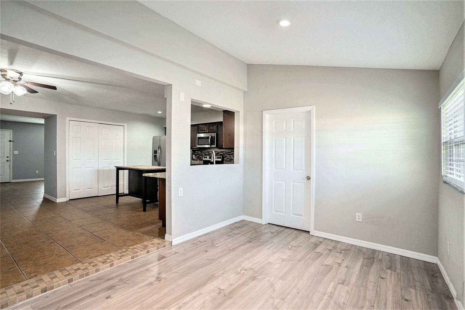 Bonus room area off the kitchen is perfect for a playroom, office or even a formal dining room.