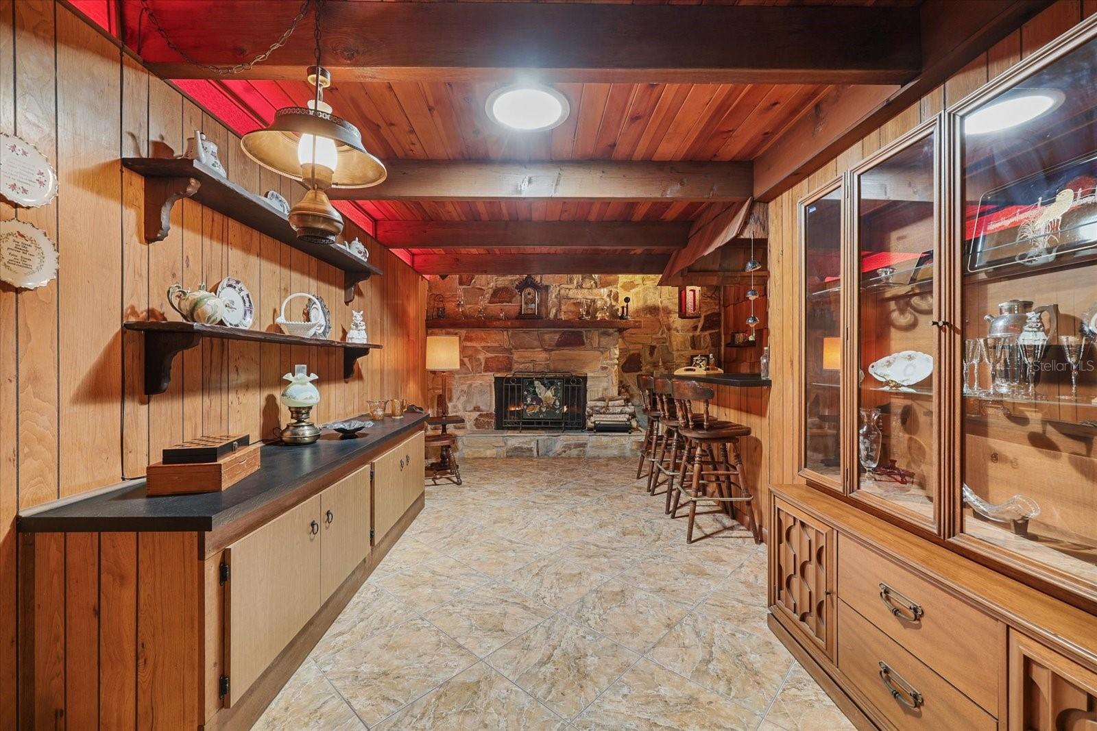 Extended Family room with Fireplace and Custom Bar