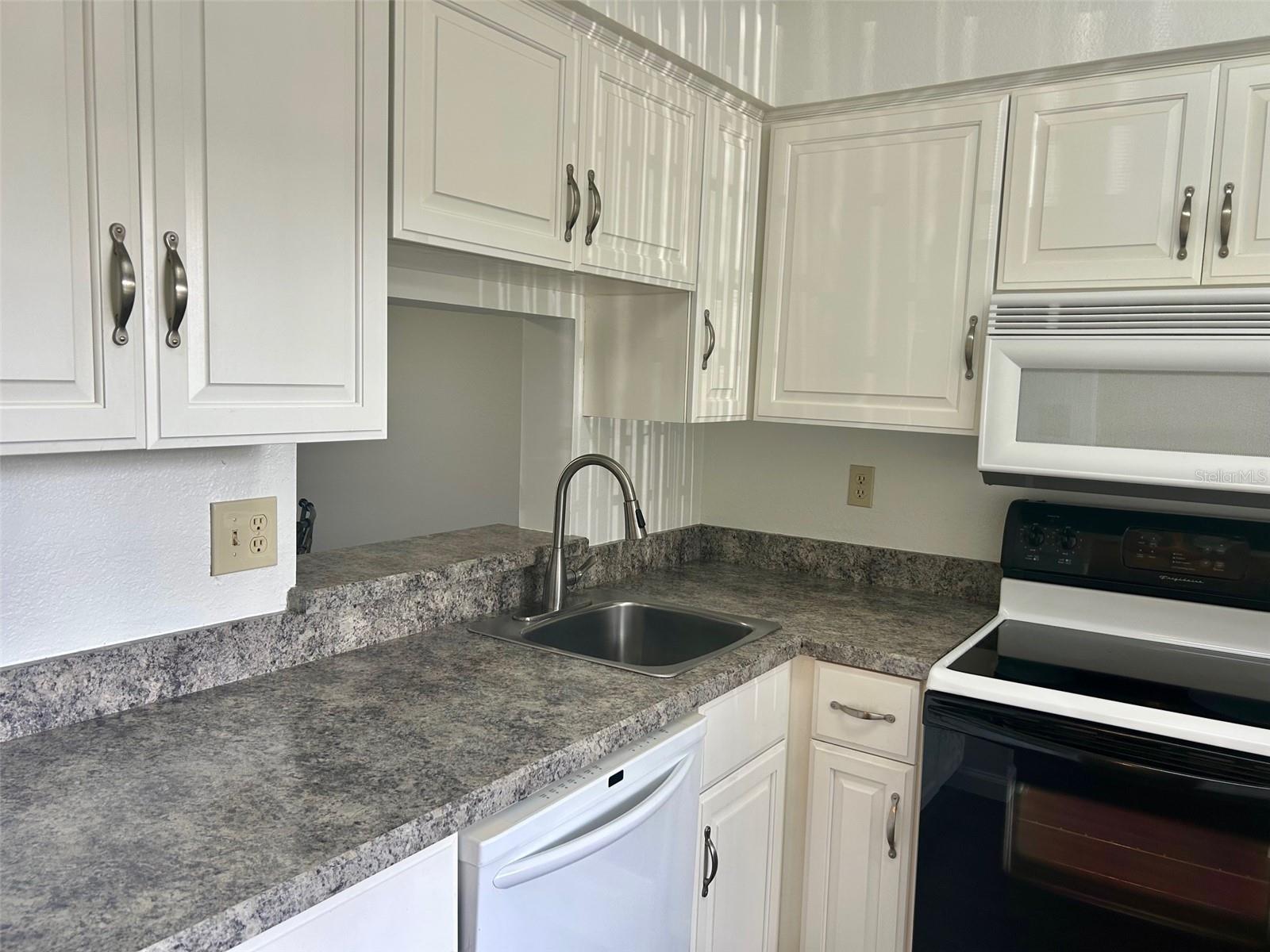 Kitchen With Pass Through To Dining Area