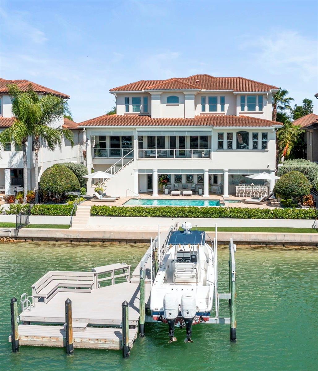 Spectacular deep-water view from your private pool/spa, dual lanais, custom outdoor kitchen or boat dock with 13,000lb boat lift& 75' waterfront