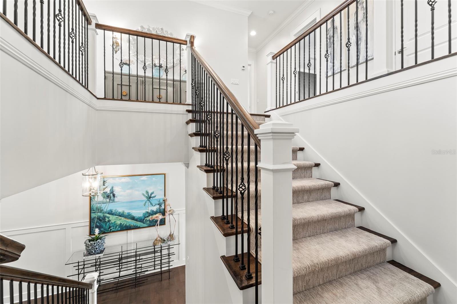 Elegant staircase leading to the upper level, connecting the home's living levels.