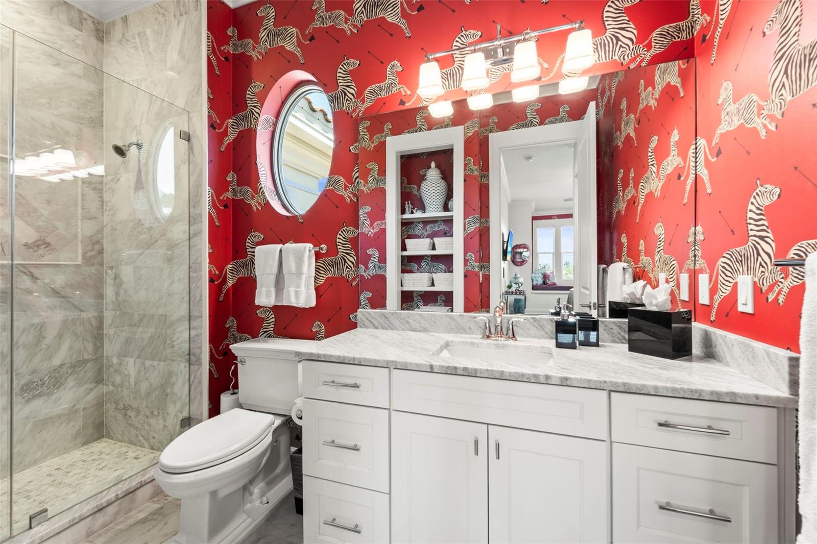 Private ensuite bath with modern vanity and designer finishes.