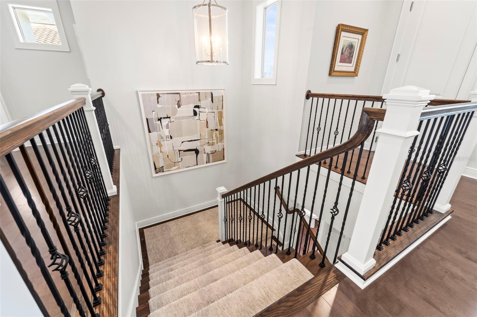 Staircase leading from the third floor down to the second level.