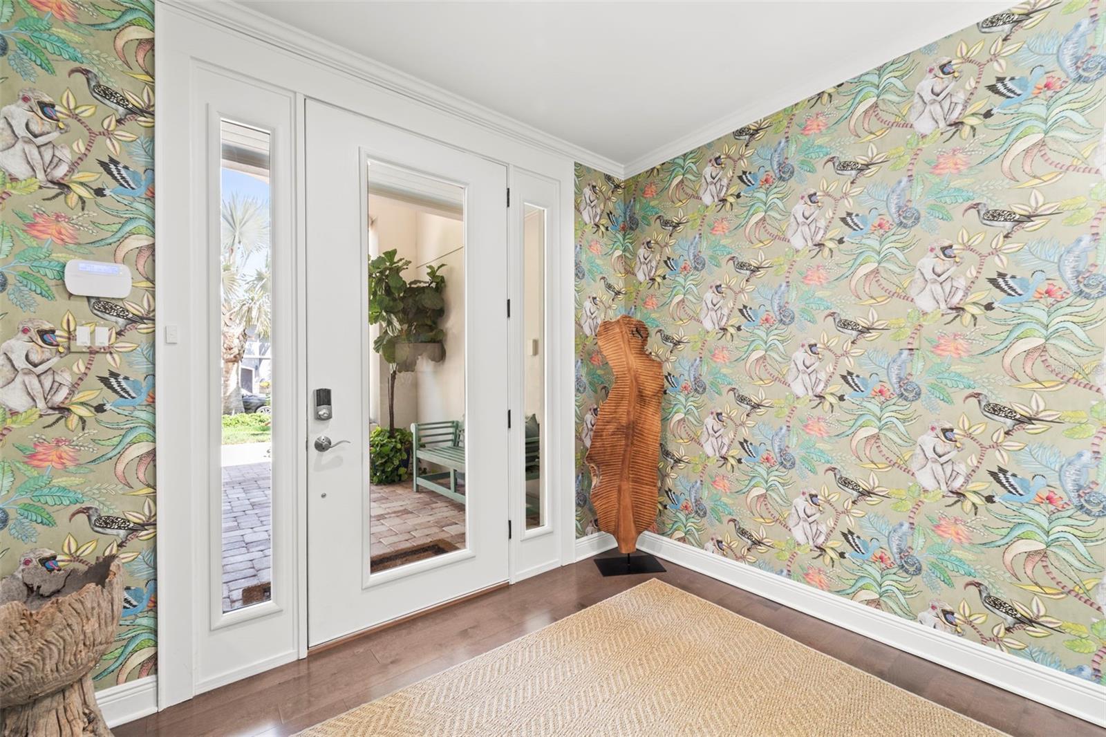 Front entry foyer featuring the main entrance and designer details.
