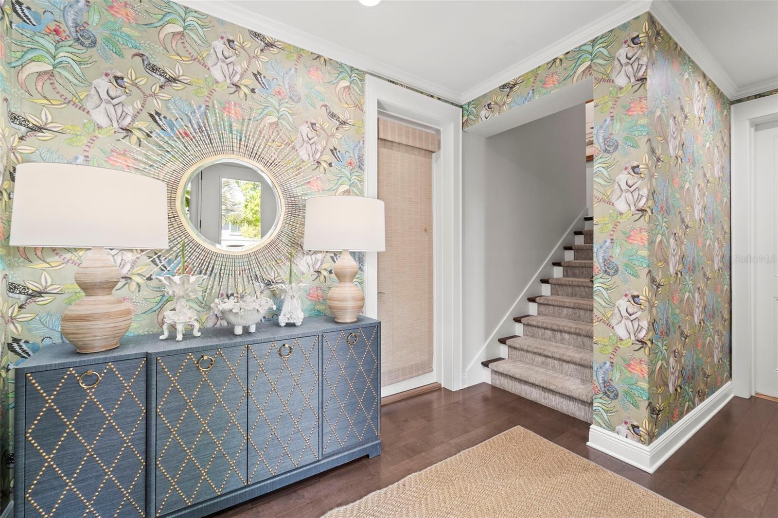 Foyer with garage access and staircase leading from the the first floor to the home's main living level.