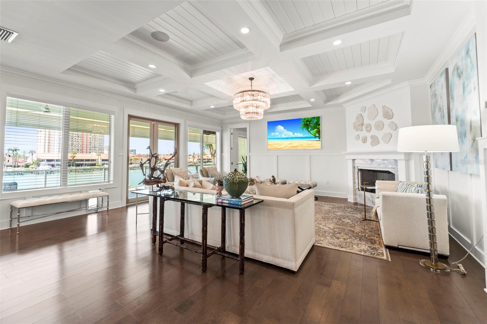 Sophisticated living room showcasing a gas fireplace as well, blending timeless architectural detail with modern elegance