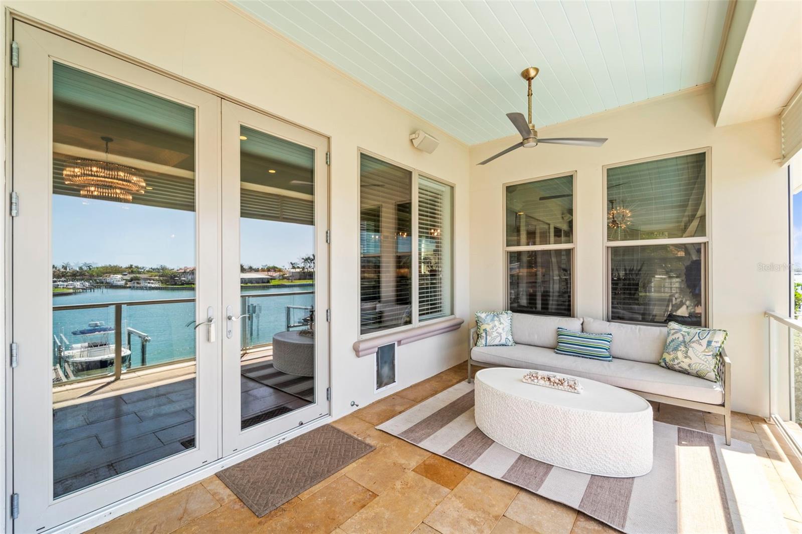 Second floor covered lanai with access from the living room with beautiful waterfront views.