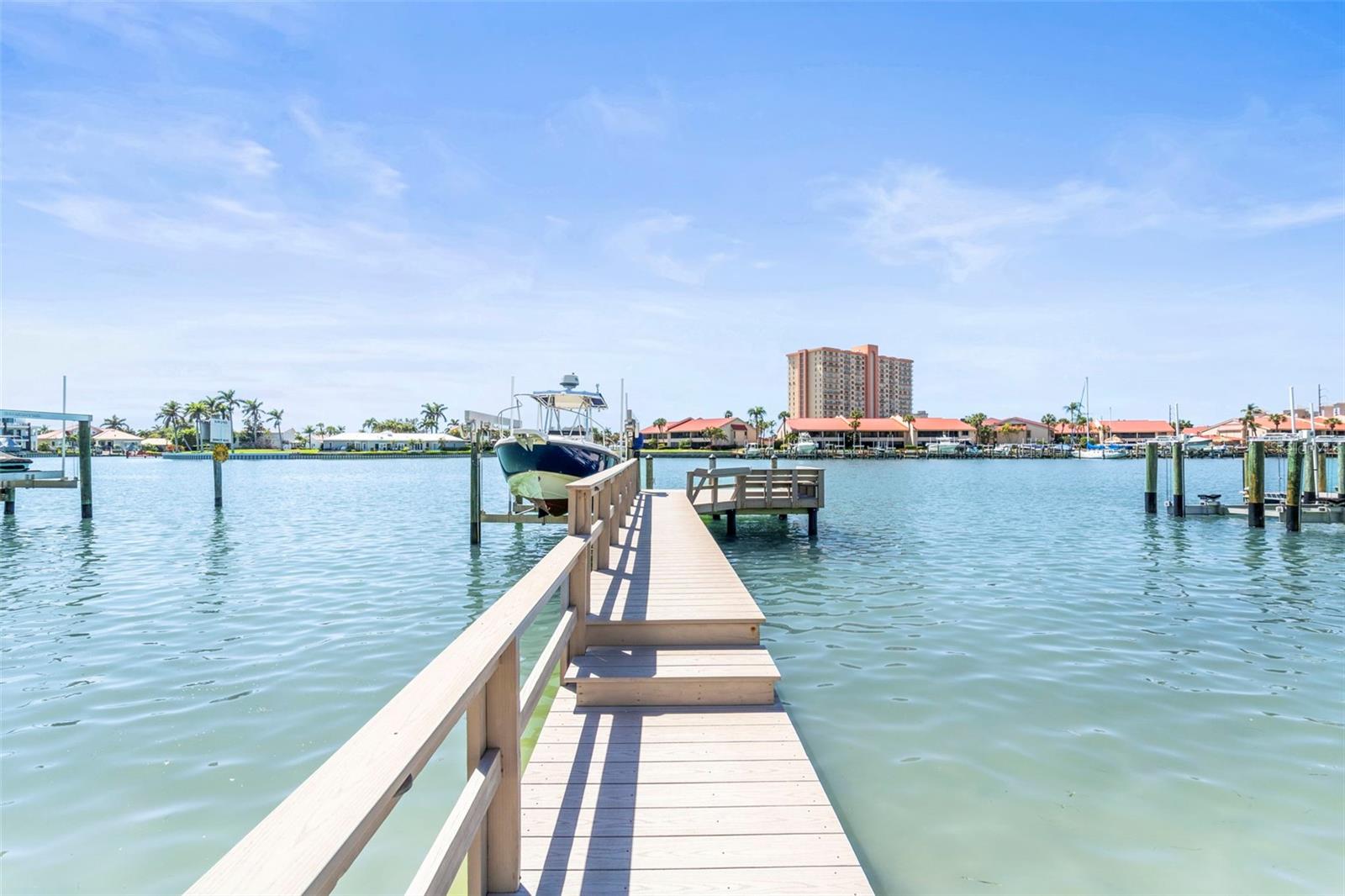 Well-equipped private tyvek walk-way & dock featuring a 13,000 lb boat lift, with electric, water and lighting