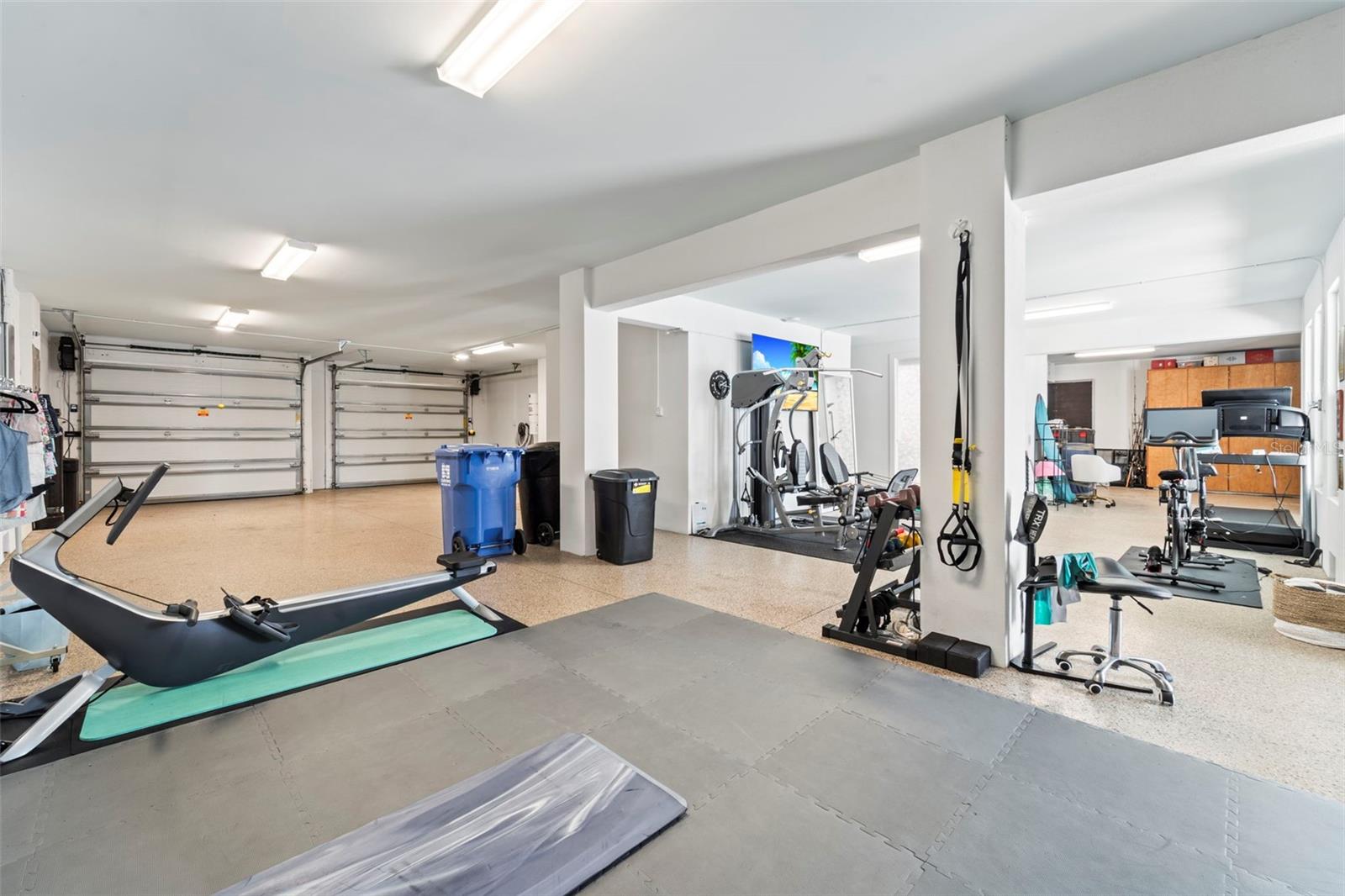 Dedicated gym and workout space located on the garage level.