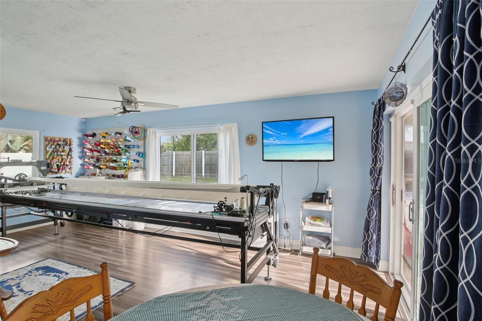 FLORIDA ROOM CURRENTLY BEING USED AS A QUILTING ROOM