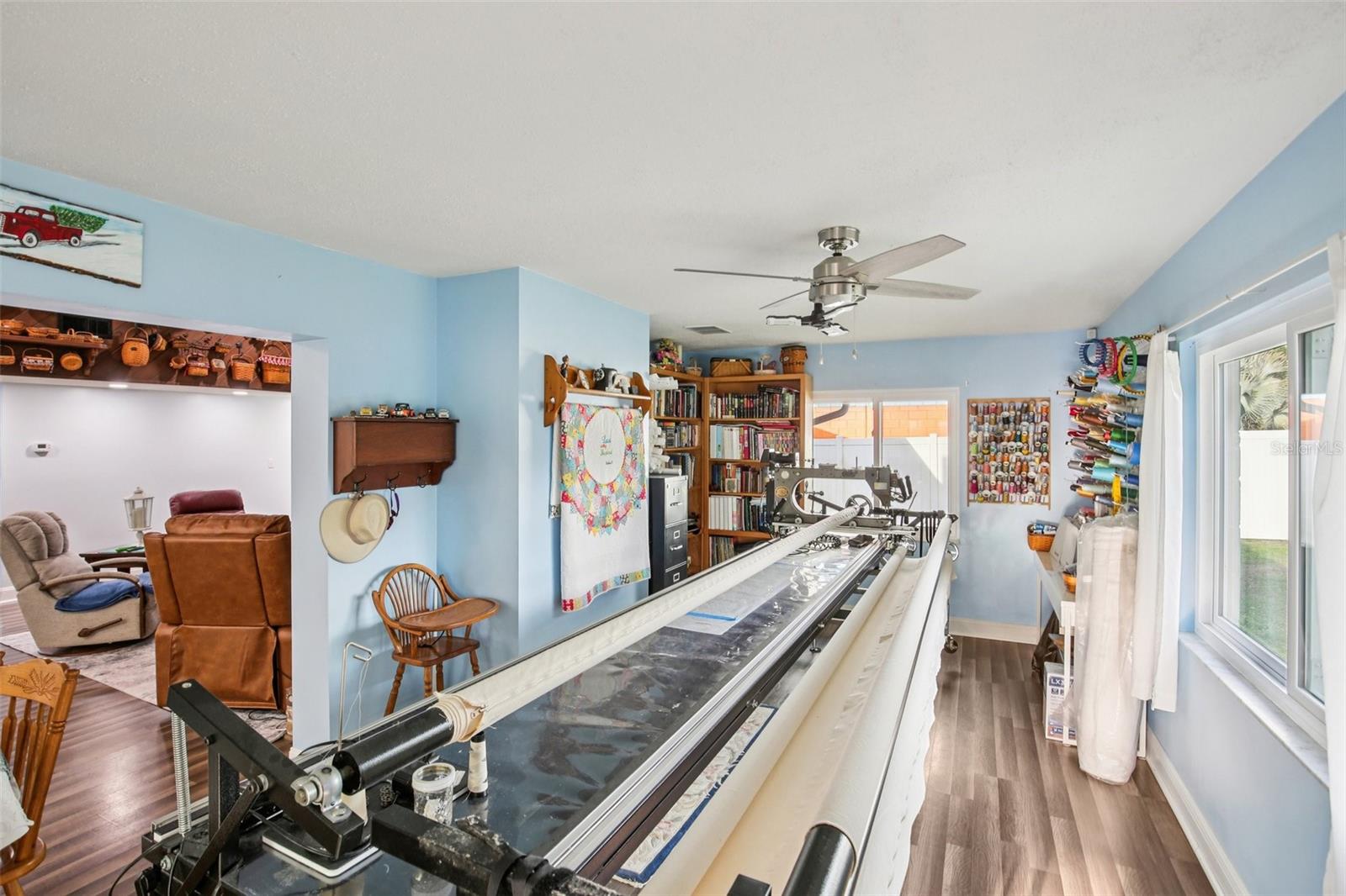 FLORIDA ROOM CURRENTLY BEING USED AS A QUILTING ROOM