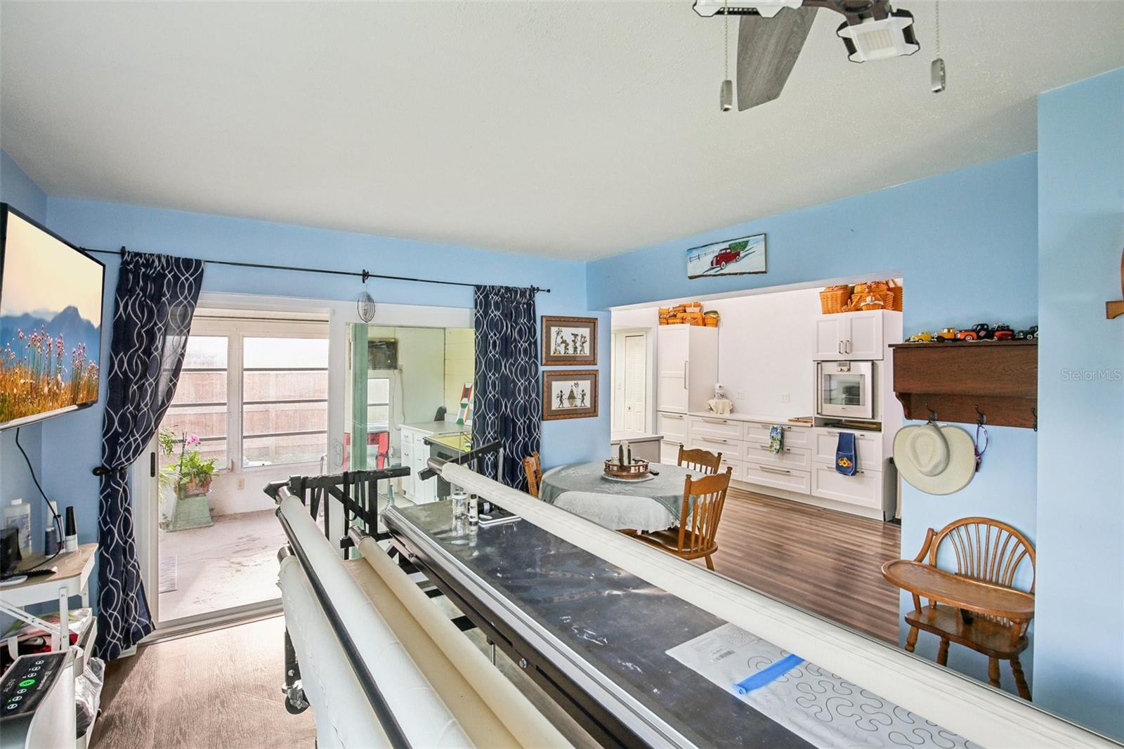 FLORIDA ROOM CURRENTLY BEING USED AS A QUILTING ROOM