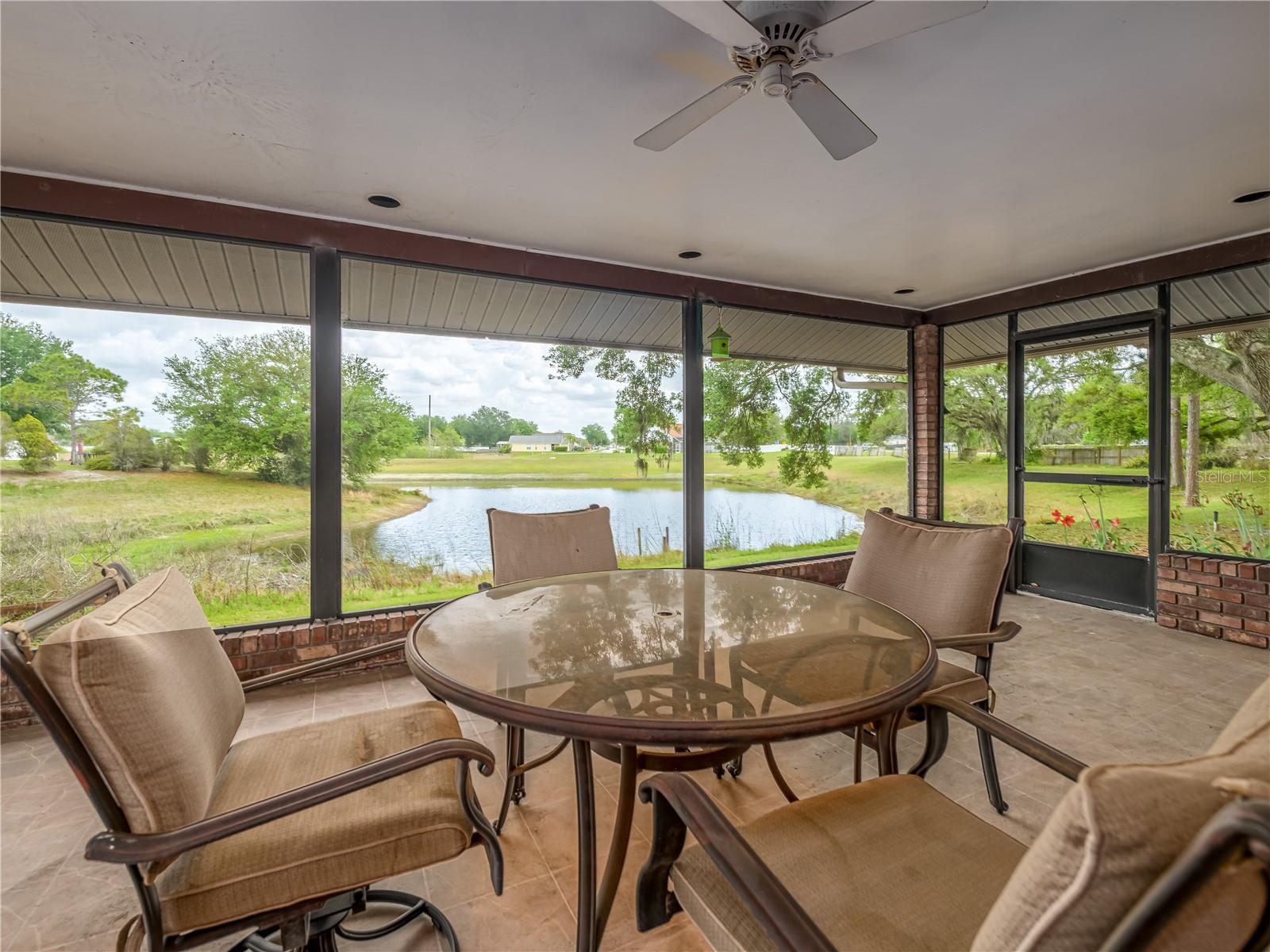 Large covered and screened lanai overlooking pond