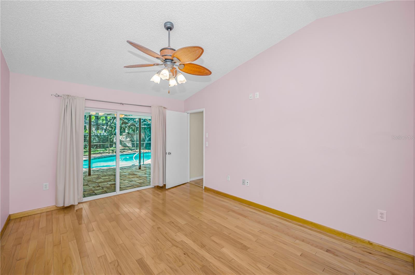 Primary bedroom opens to pool