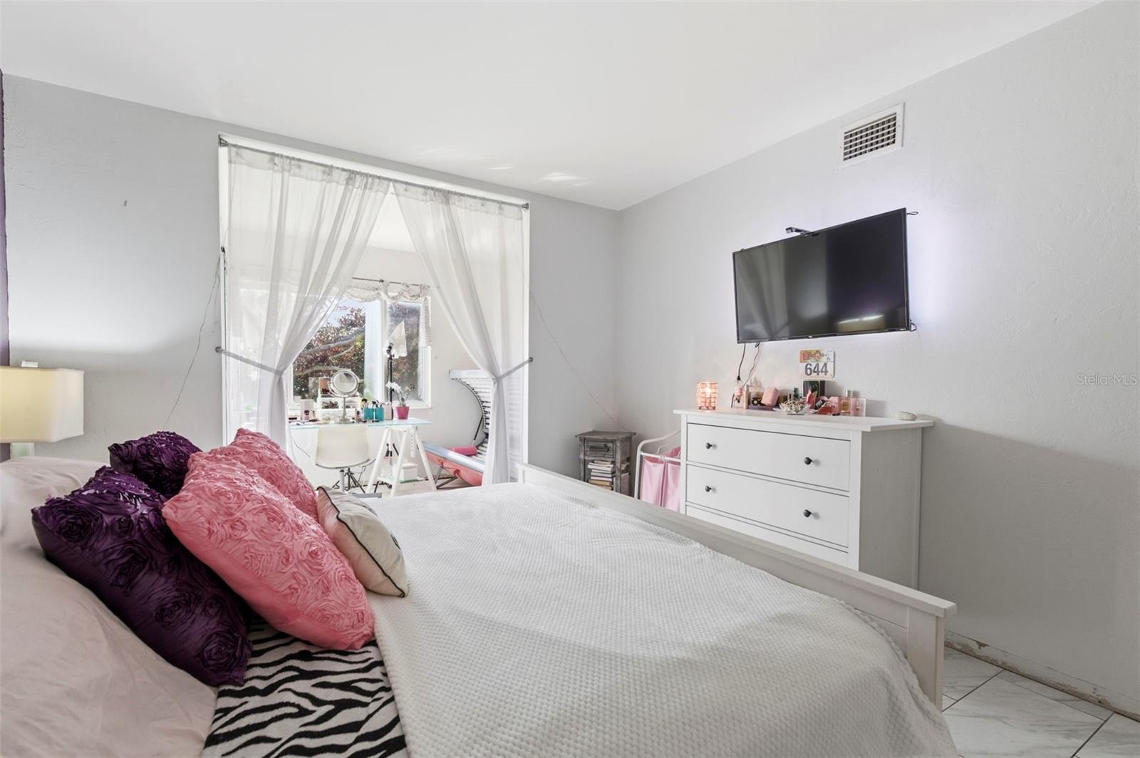 Bedroom with three closets.