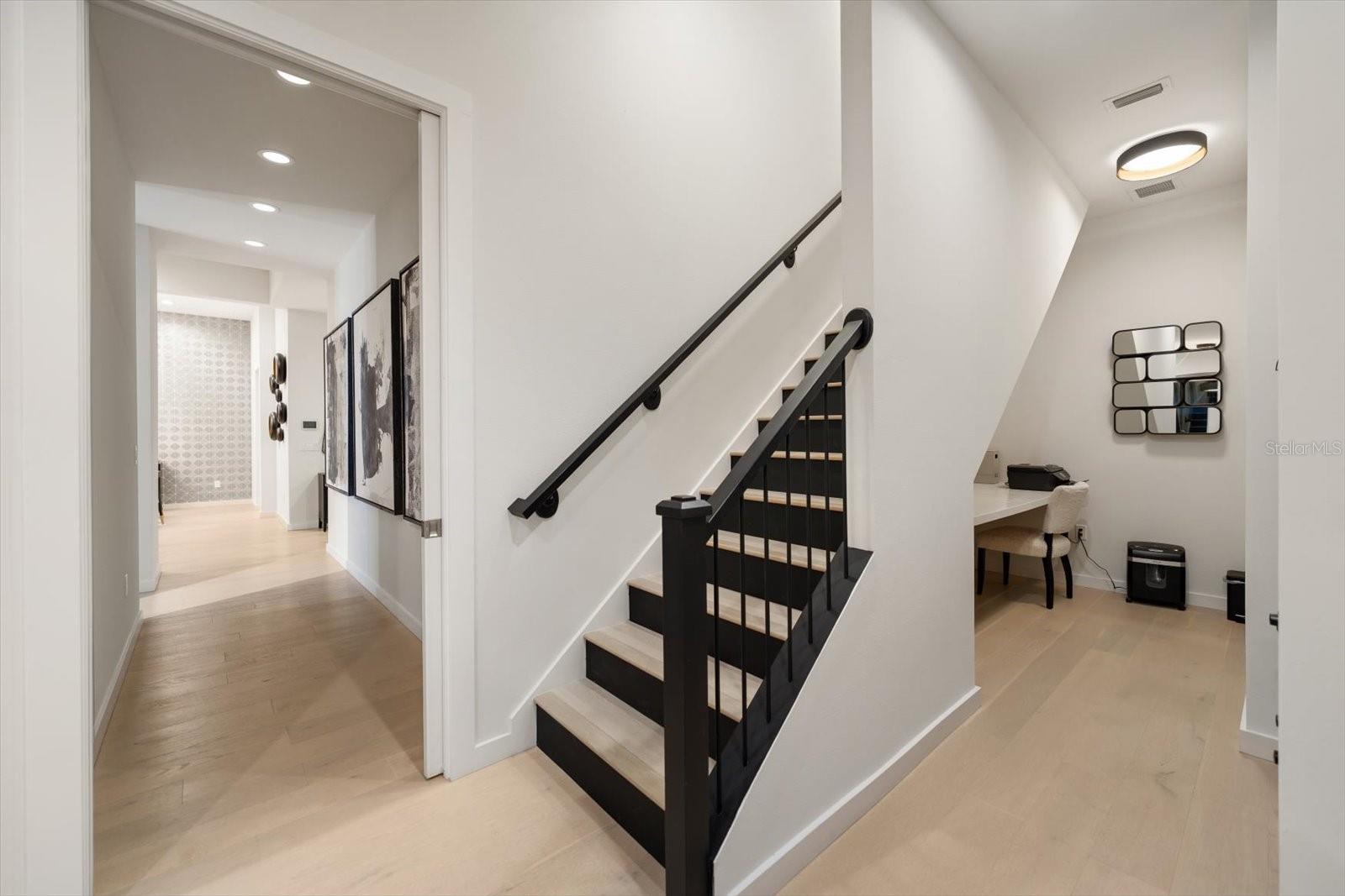 stairs off of office to media room and bedroom #4/workout room