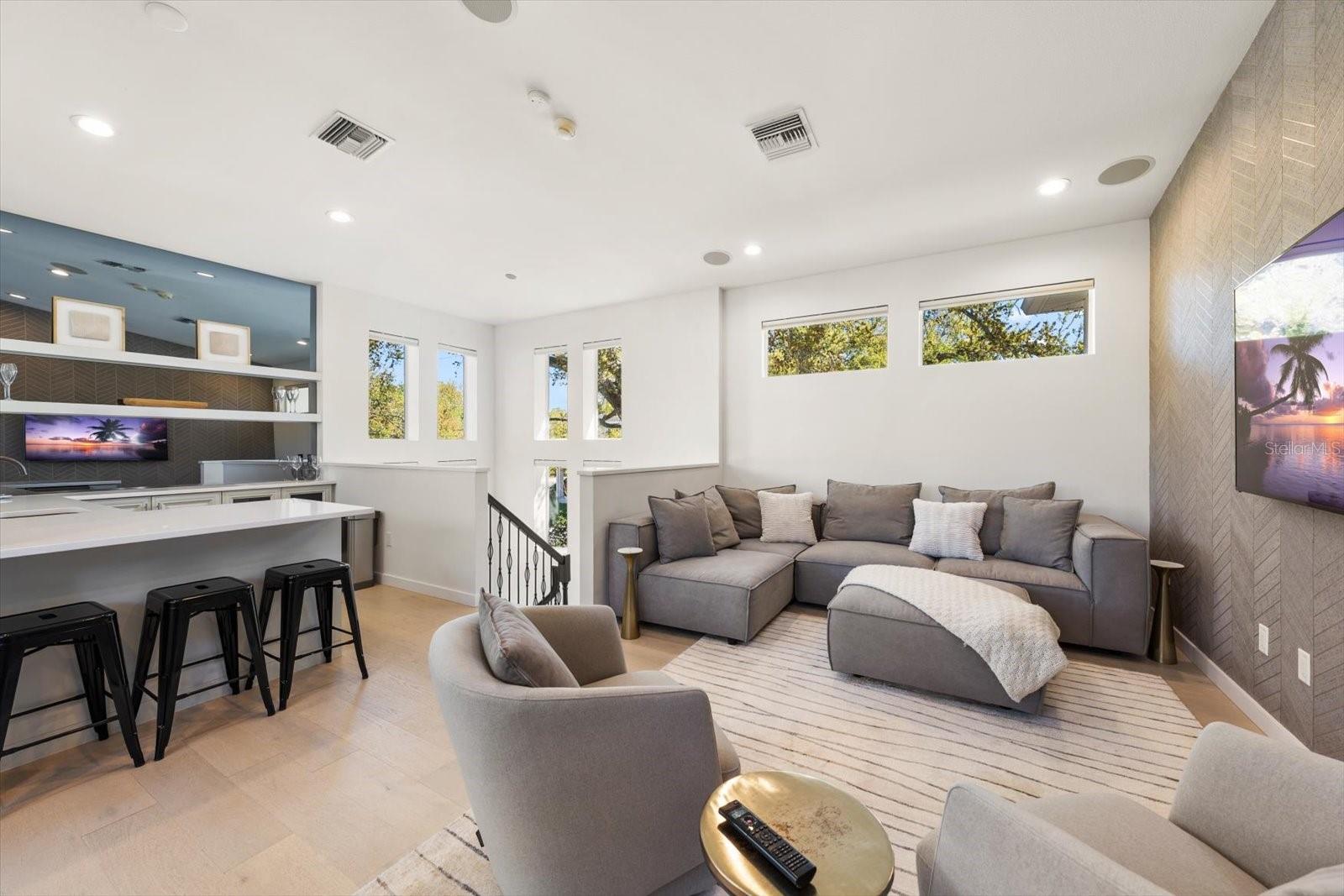 game room with wet bar, wine fridge and cigar humidor