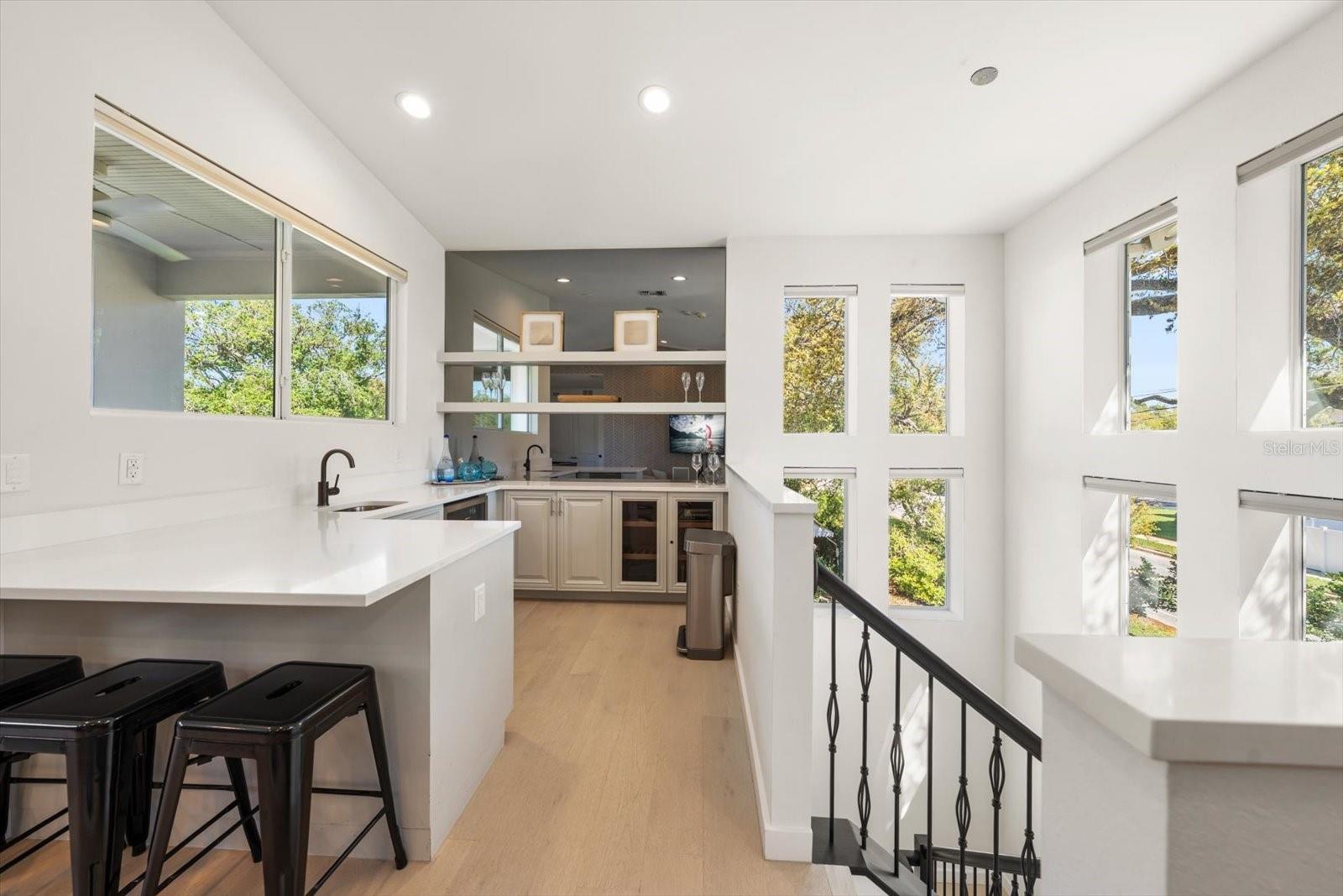 wet bar area with cigar humidor and wine fridge