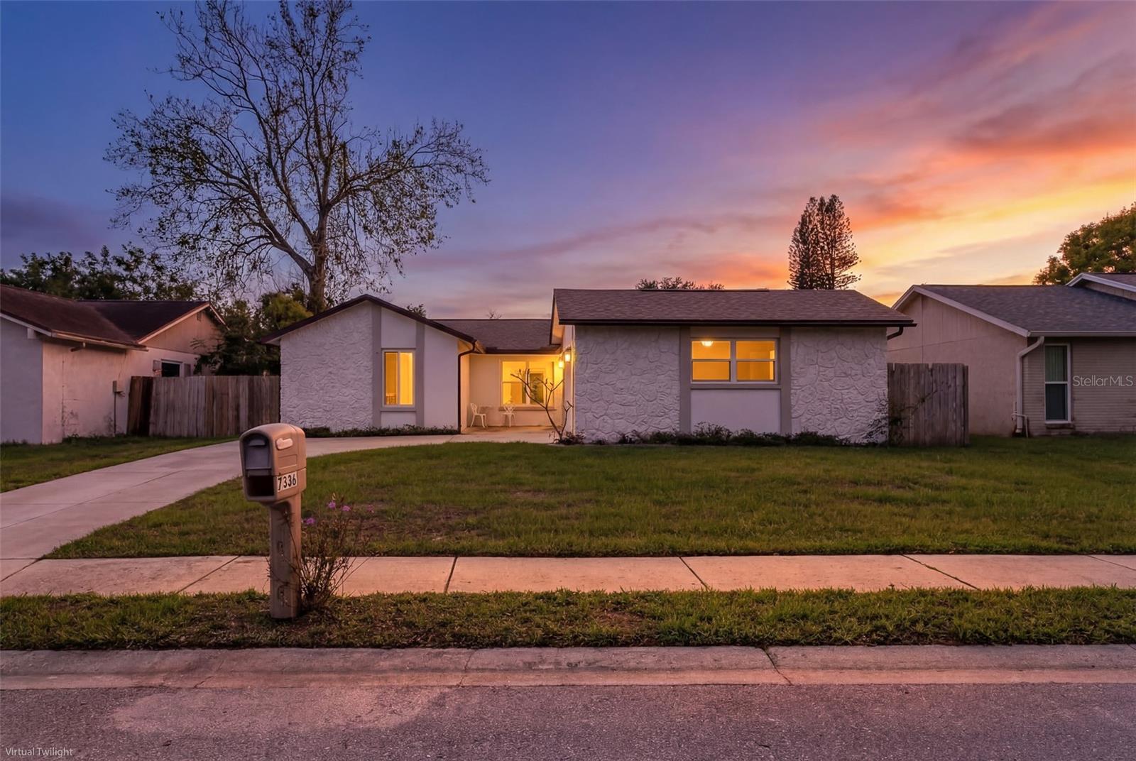 SUNSET PHOTO OF FRONT OF HOUSE