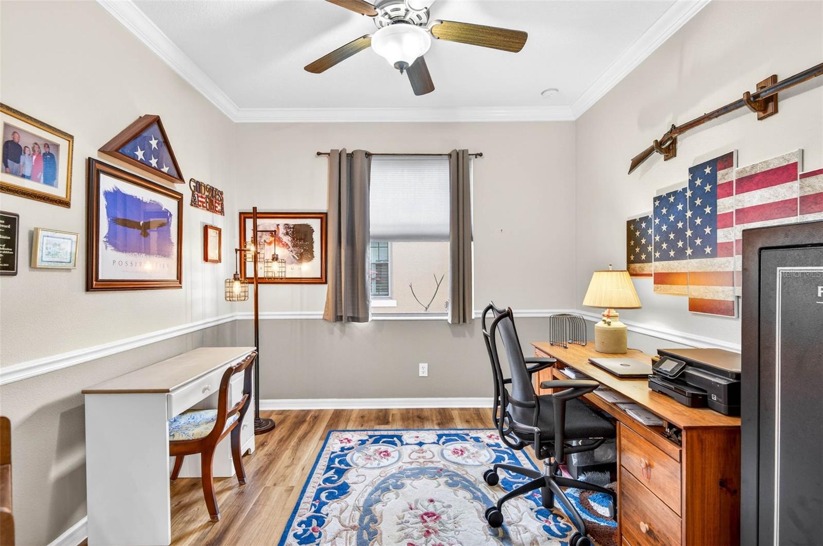 Office with ceiling fan, chair rail and crown molding