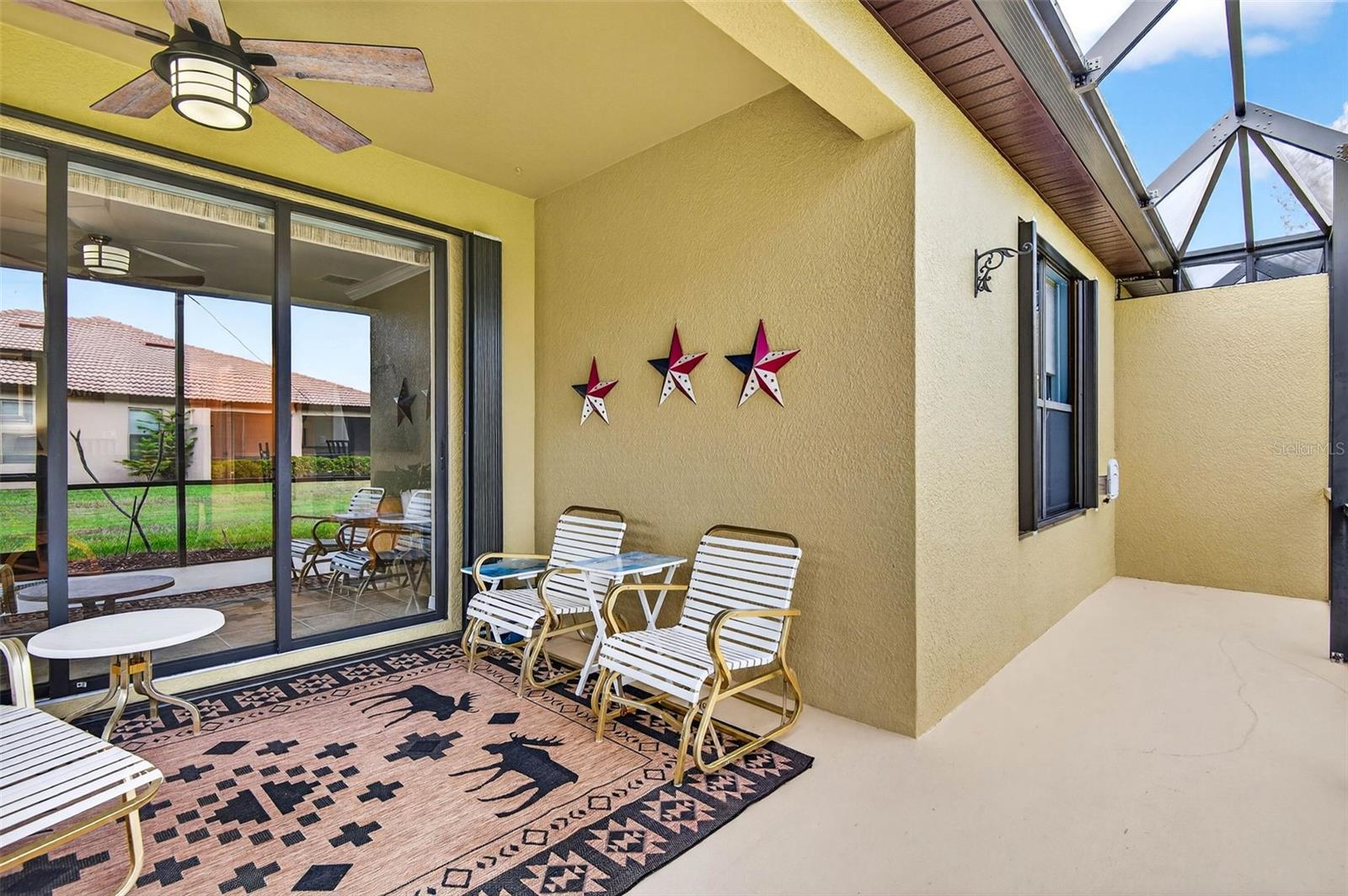 Screened and covered lanai. Accordian shutters for easy closing on all windows and sliders.