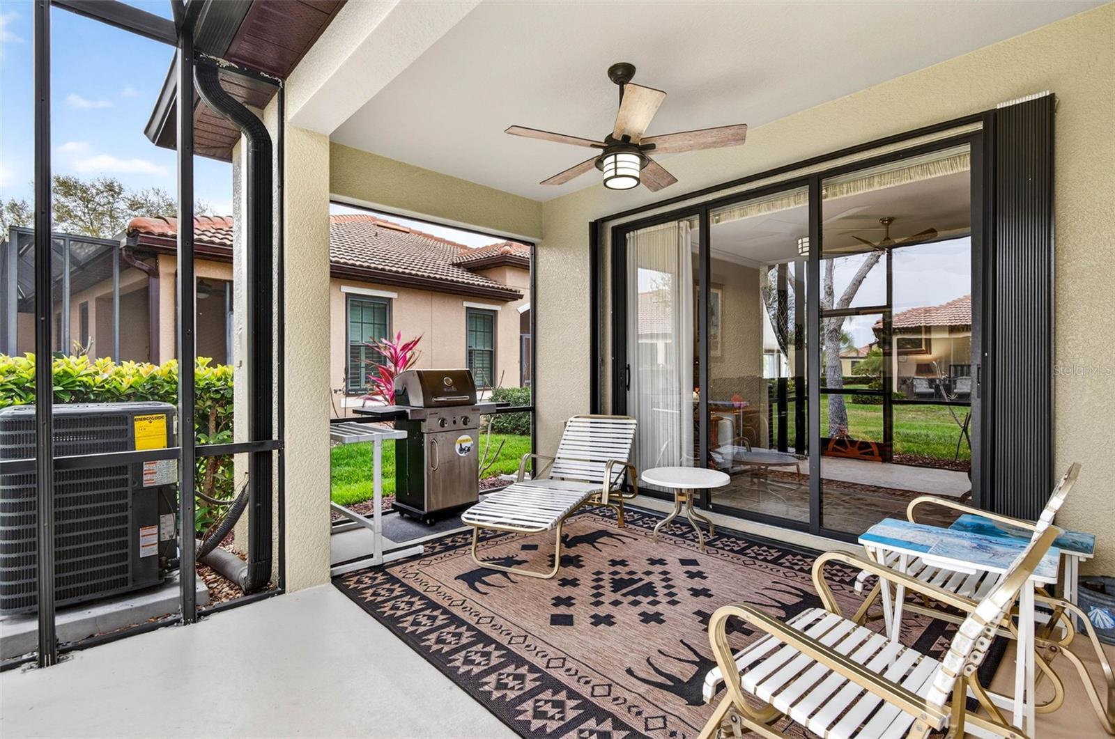 Screened and covered lanai. Gutters around entire unit. Accordian storm shutters for easy closing.