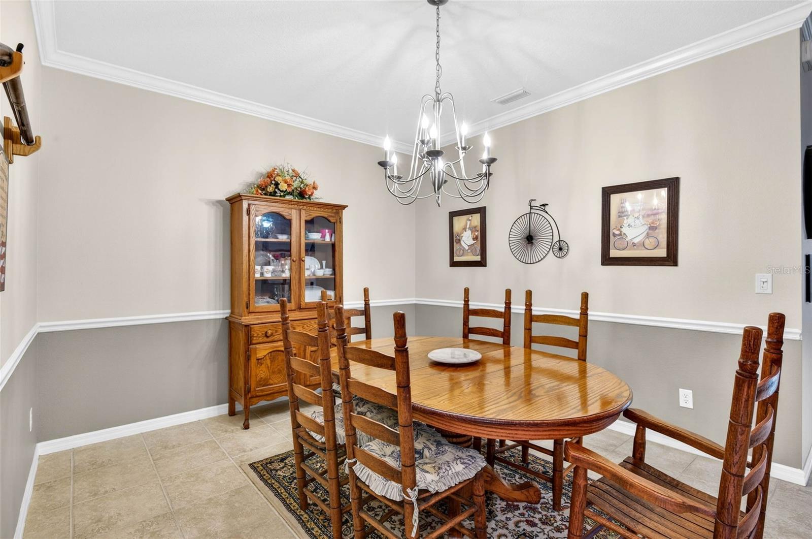 Dining room with chair rail and crown molding