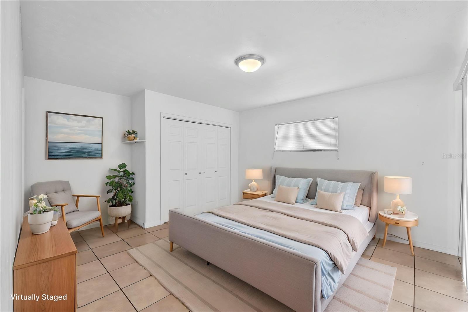 Spacious primary suite offers its own private bathroom with tub/shower combination and a large closet.