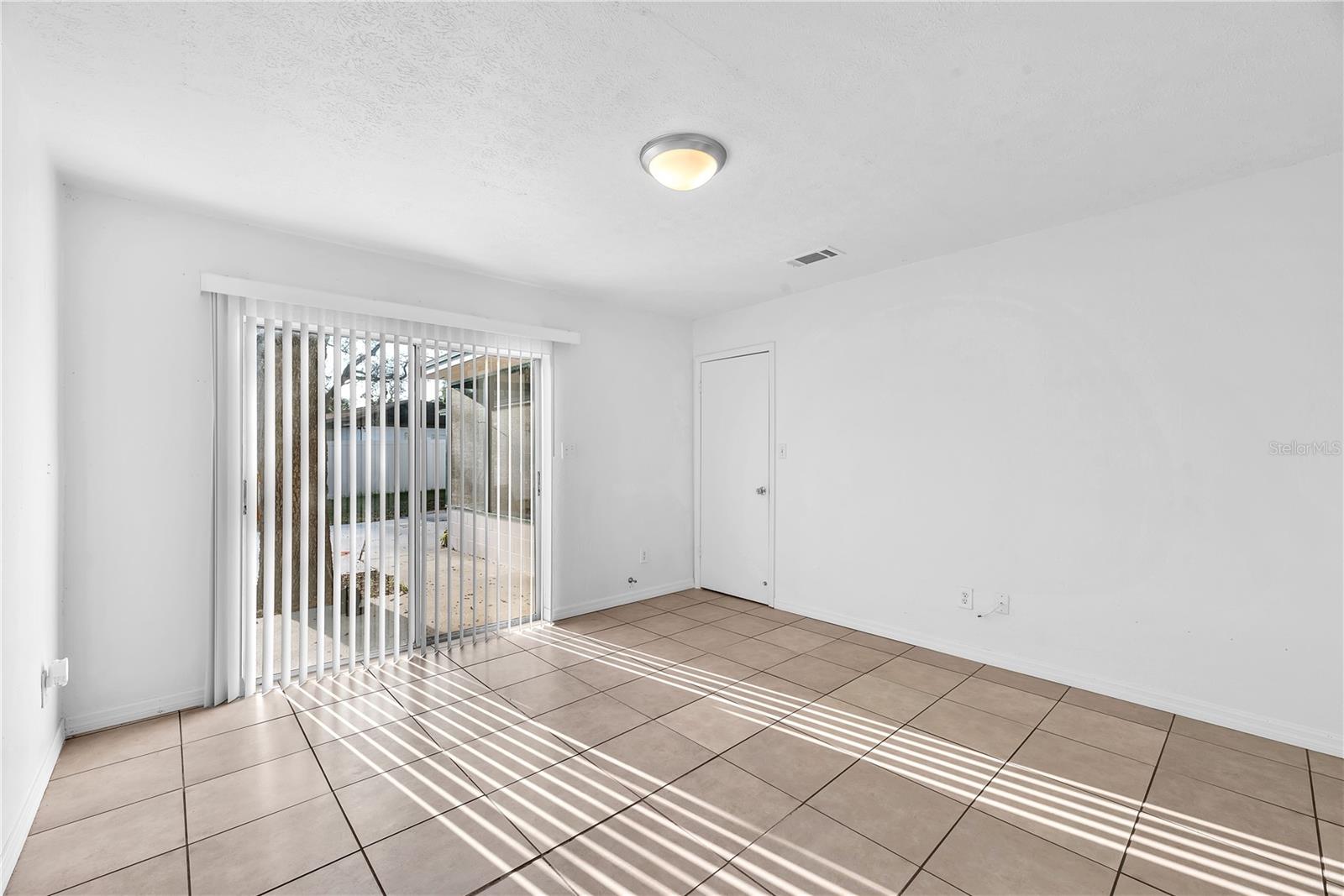 This primary suite has direct access to the backyard.