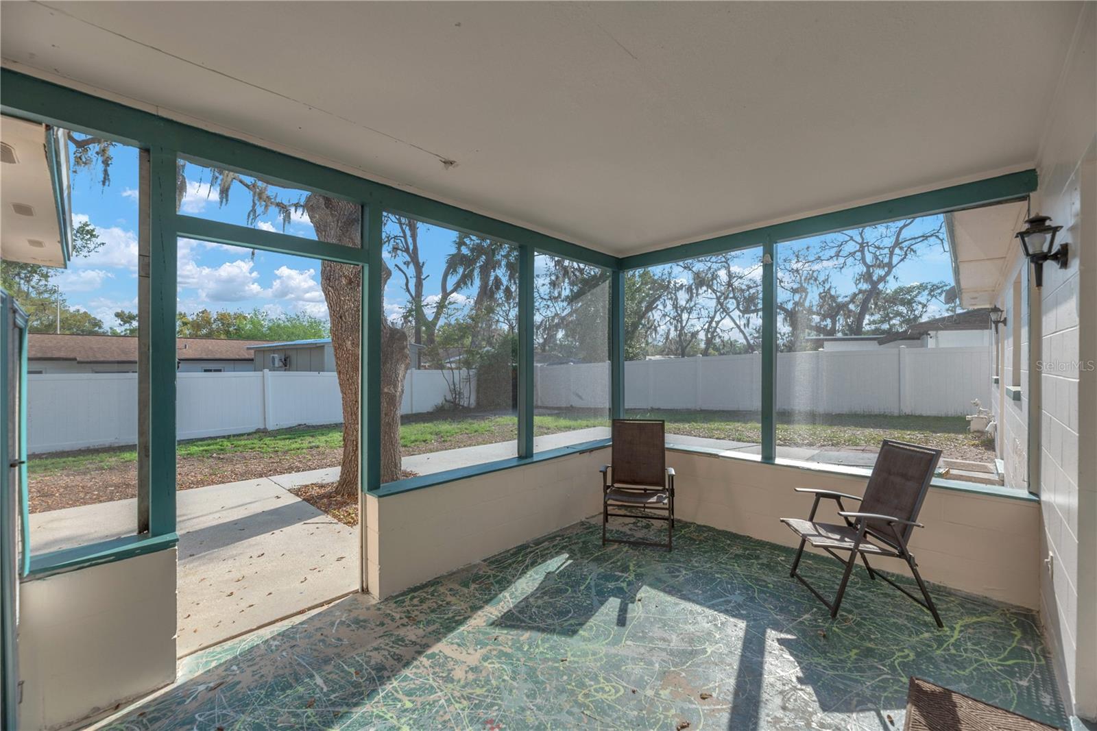 Enclosed back porch and patio.