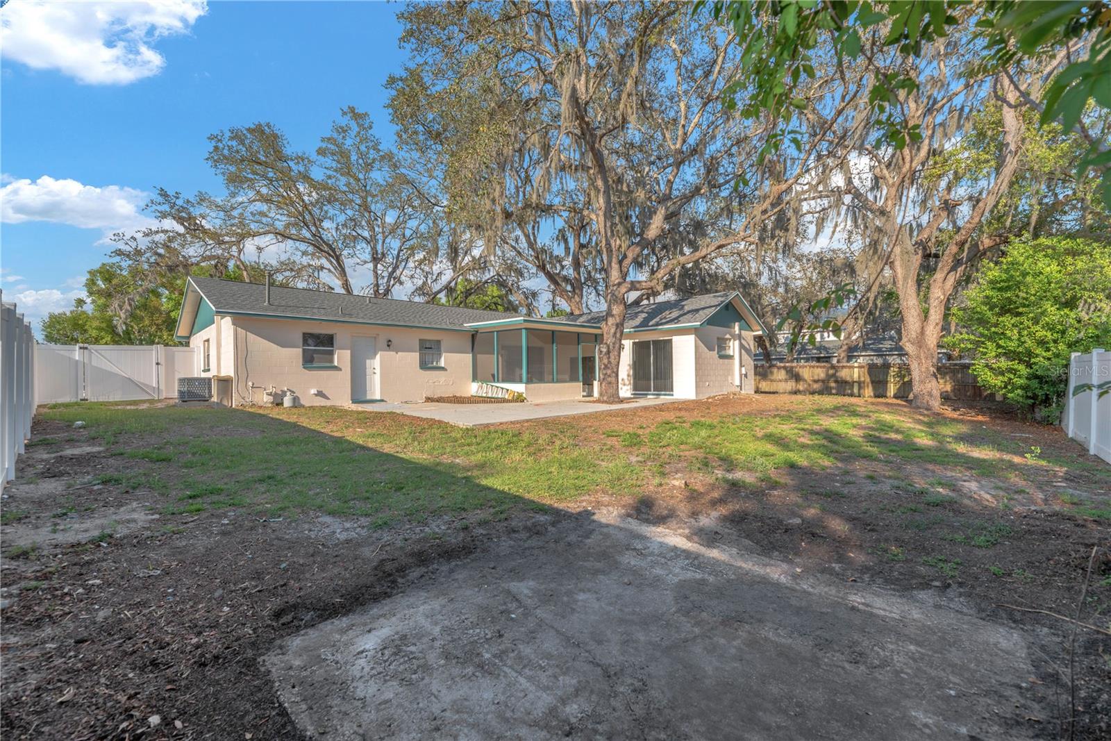 The expansive lot gives you the freedom to expand, garden, entertain, or simply enjoy extra space—without HOA or CDD restrictions.