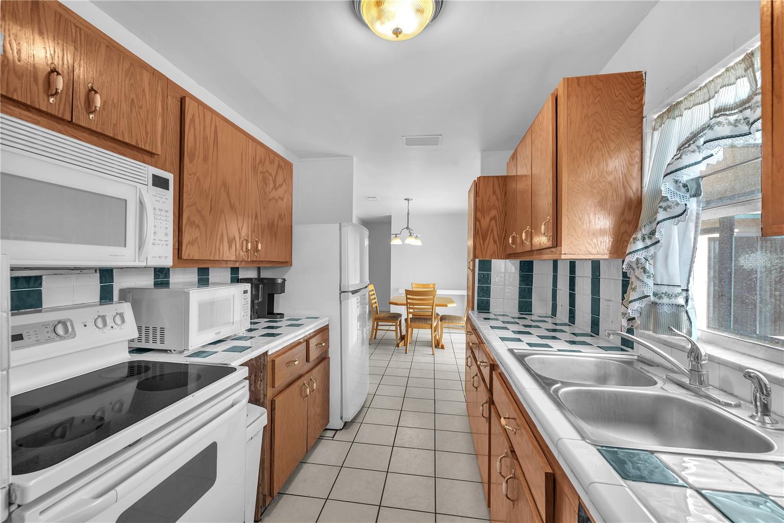 The galley-style kitchen is thoughtfully designed with efficiency in mind