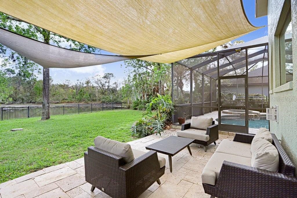 Exterior lanai sitting/grilling area