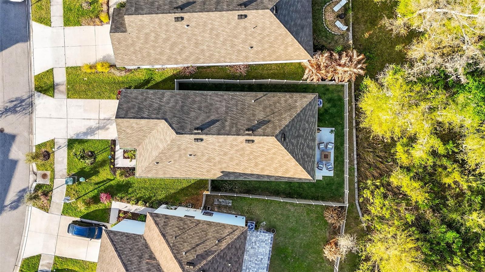 Conservation lot, fully fenced, with screened lanai and extended outdoor space.