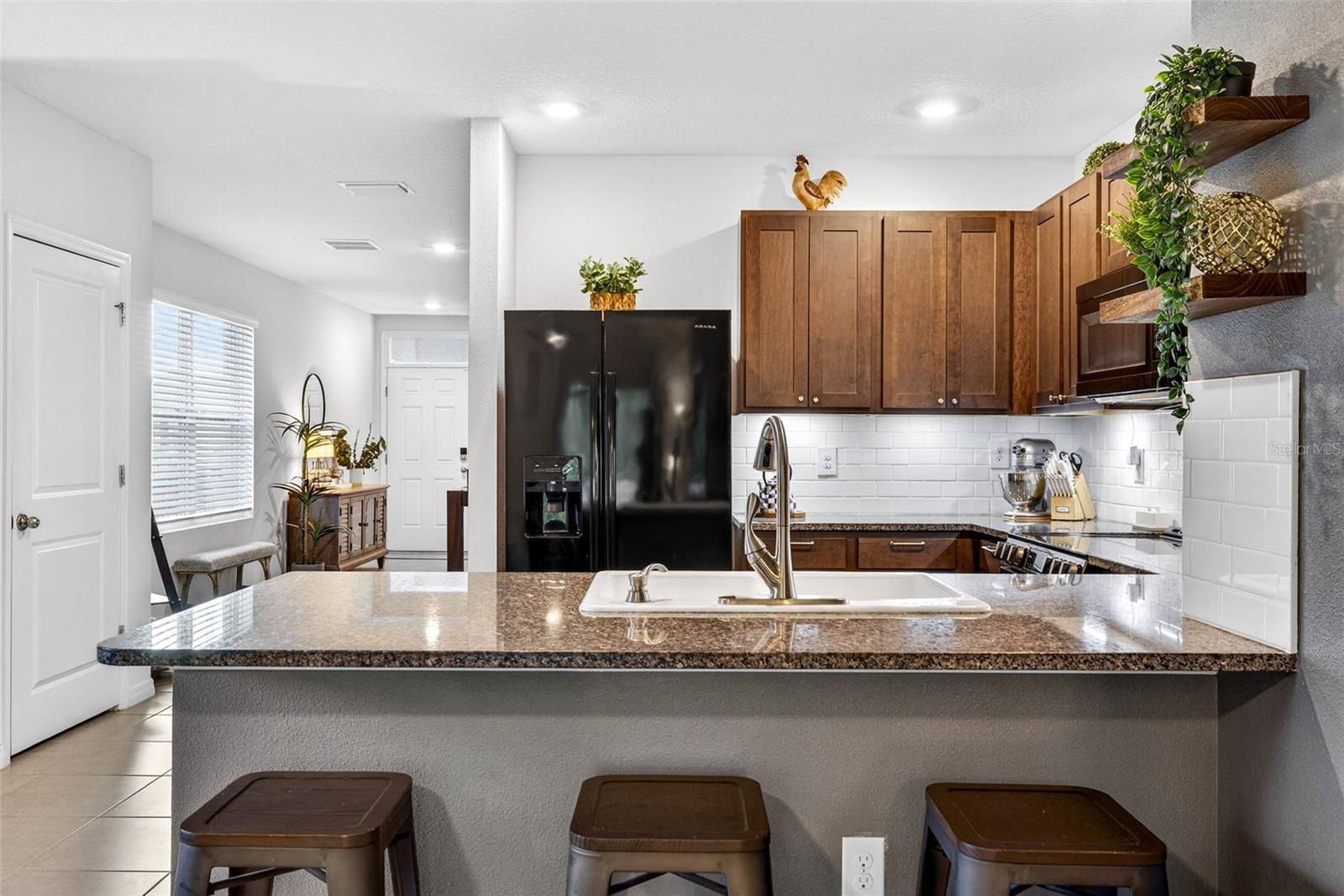 Sit informally at the kitchen or dine in separate dining room.