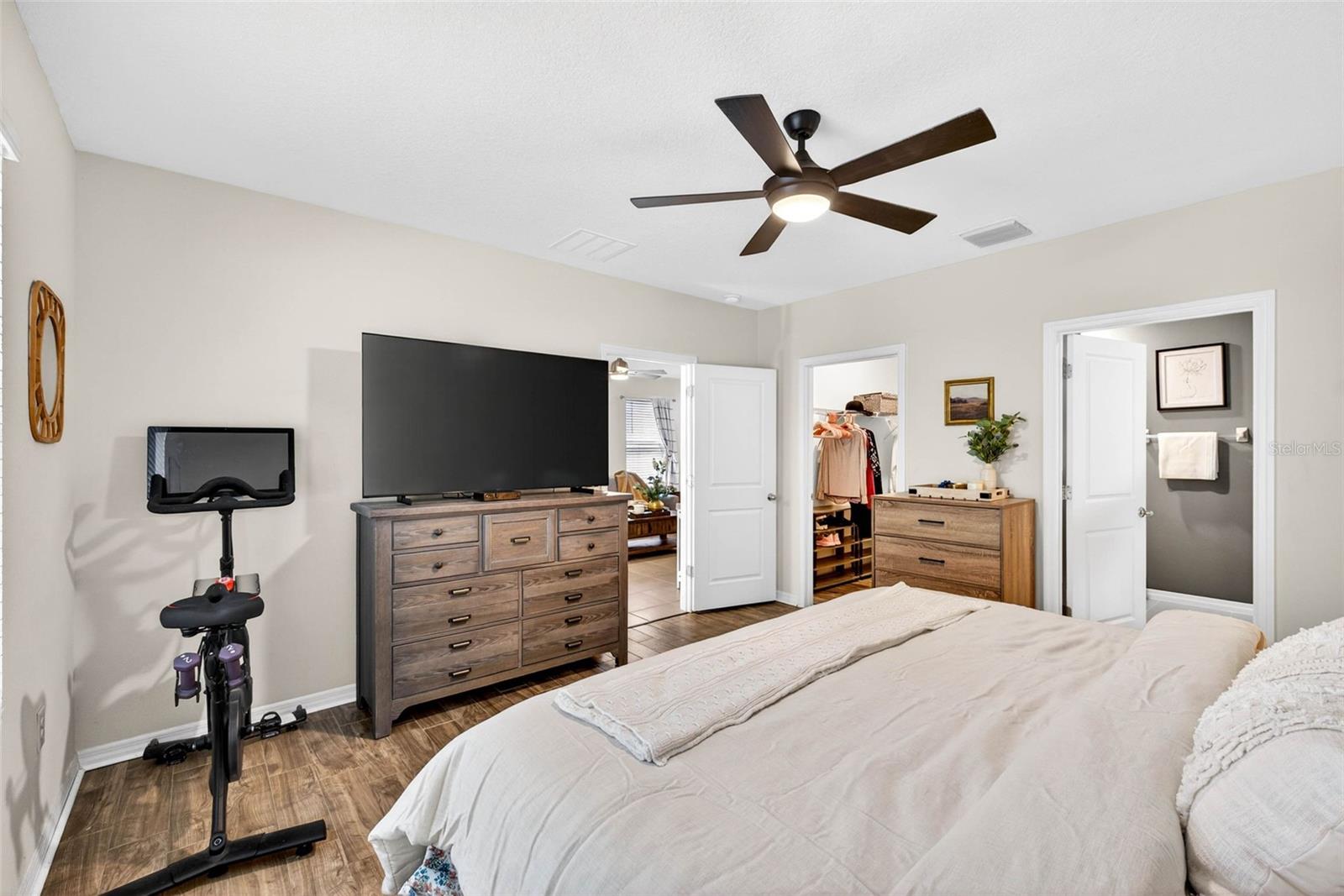 Primary looking toward walk in closet and ensuite bath