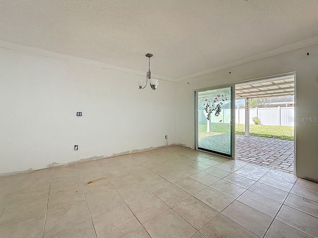 Glass sliding door to back terrace and backyard