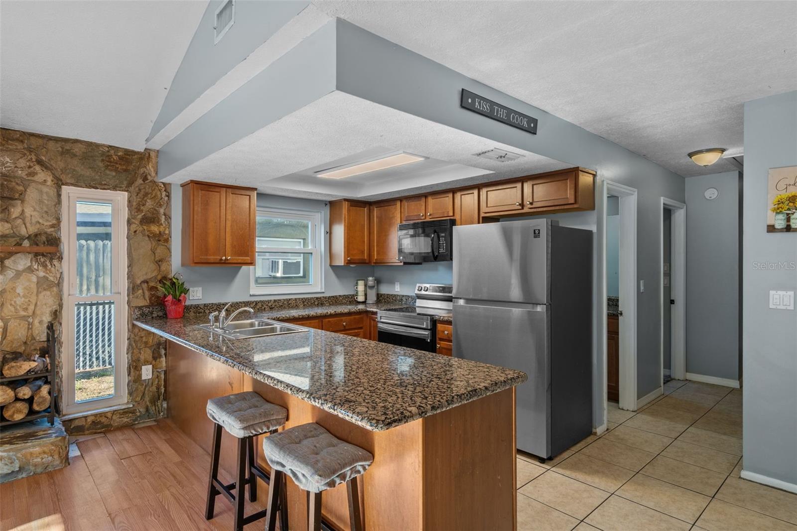 kitchen pantry and hallway to primary bed