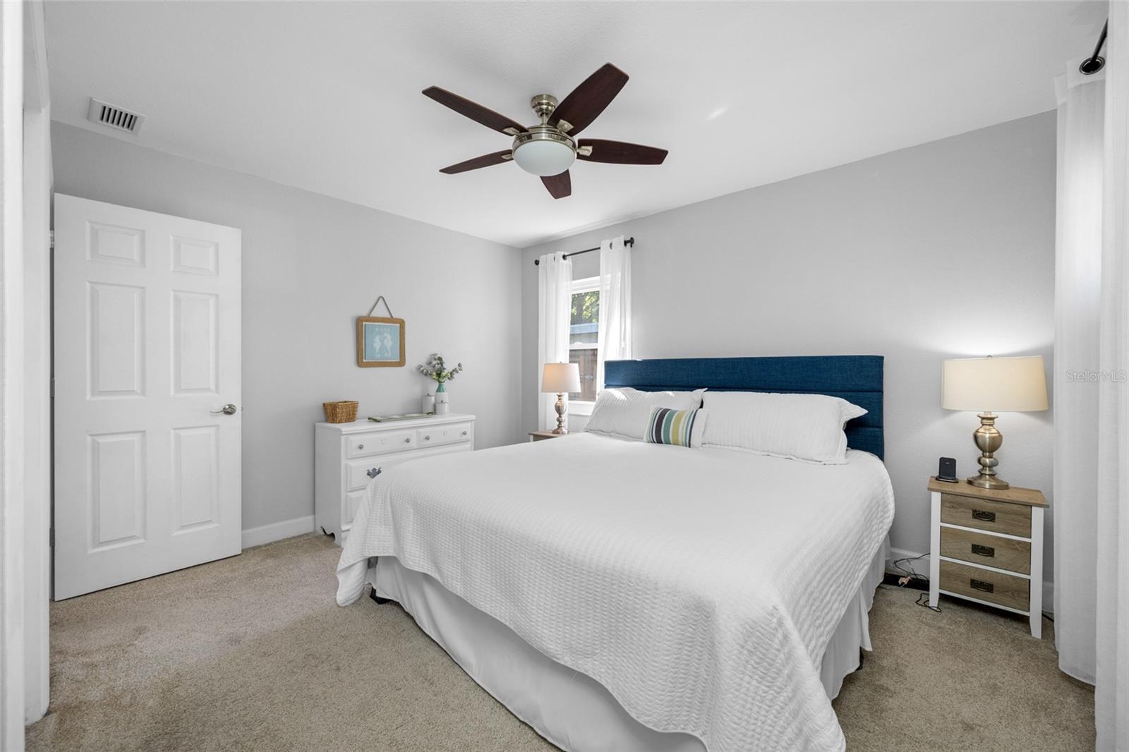 Primary Bedroom with ensuite updated bathroom featuring walk-in shower