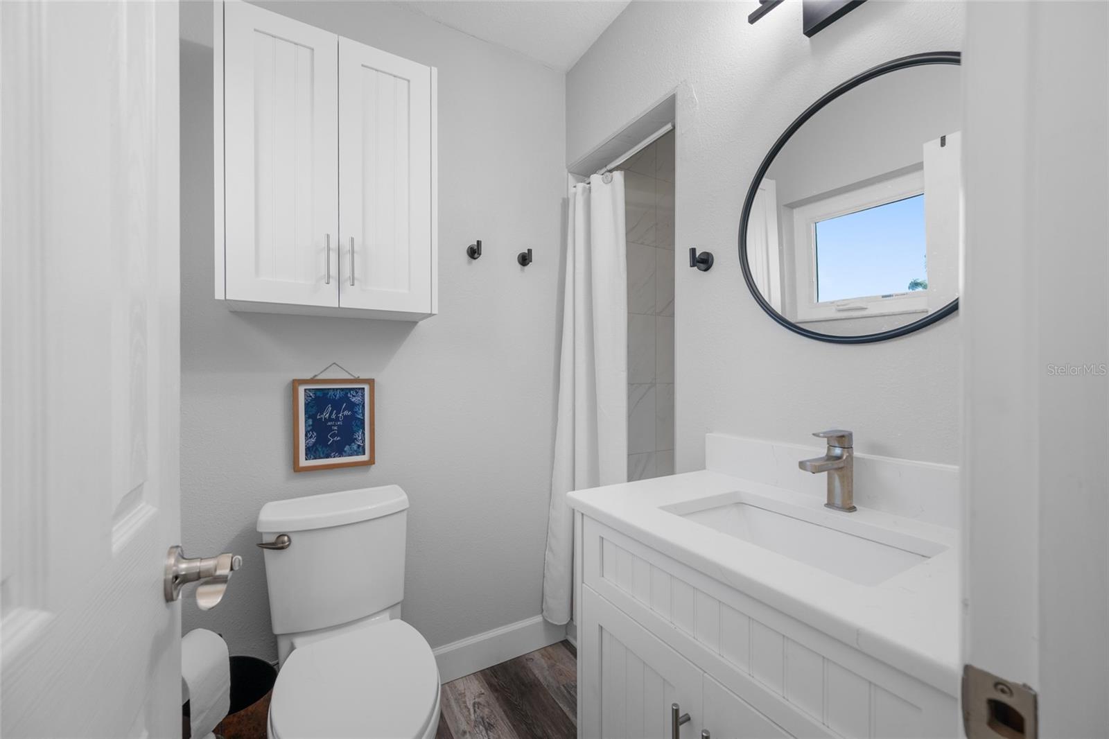 Primary Bedroom with ensuite updated bathroom featuring walk-in shower